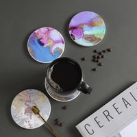 طقم من 4 قواعد اكواب سيراميك من لوها ب4 انماط مع ق...