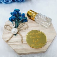 مجموعة (12) تولة عطر مسك بقاعدة ورد مع التنسيق ولو...