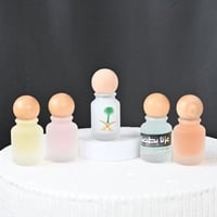 مجموعه(12) عطورات بغطاء خشبي بدون طباعه