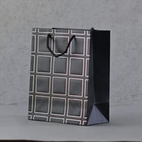 مجموعه (12) اكياس هدايا مخطط ابيض