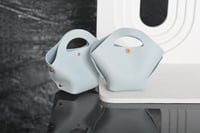 مجموعه(12) شنطة جلد توزيعات لون سماوي