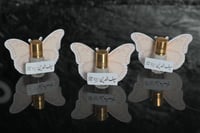 مجموعه(12) عطر ربع تولة مع طباعه فراشة وكتابة عبار...