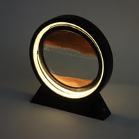 إضاءة ليد مع لوحة زجاج بتصميم الرمال المتحركة