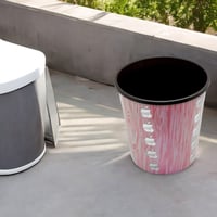 سلة نفايات مستديرة وردي