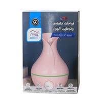 فواحة عطرية أنيقة بشكل مزهرية مع إضاءة خافتة - تعم...