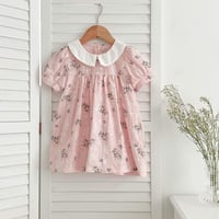 فستان أطفال وردي ذات نقشه