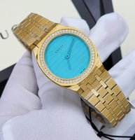 ساعه قوتشي ذهبي بكرستال