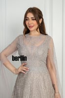 فستان سهرة شامبين مطرّز بتفاصيل براقة وأكمام شفافة...