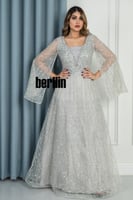 فستان سهرة فضي مطرز بالكامل باكمام شفافة واسعة وتص...