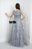 فستان سهرة فضي ملكي بتطريزات فضية فاخرة وتصميم راق...