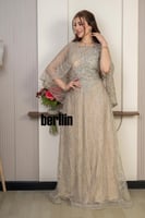 فستان سهرة شامبين مطرّز بتصميم فاخر وأكمام شفافة و...