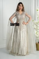 فستان سهرة ذهبي مطرز بالكامل مع كاب تول شفاف يمنح...