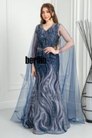 فستان سهرة أزرق ملكي مطرّز بتفاصيل براقة وأكمام شف...