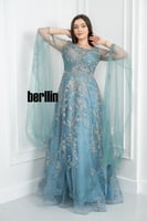 فستان سهرة أزرق ملكي بتطريزات فضية فاخرة وتصميم را...