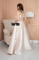 فستان سهرة مطرز بزخارف الورد لون كريمي