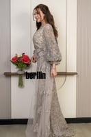 فستان سهرة شامبين مطرّز بتفاصيل فاخرة وأكمام شفافة...