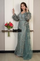 فستان سهرة اخضر ساجي مطرّز بتفاصيل فاخرة وأكمام شف...