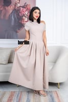 فستان أنيق بلون بيج ناعم بتصميم عصري راقٍ يتميز بك...