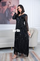 فستان أسود ترتر طويل بتطريز ترتر لامع ولمسات شفافة...