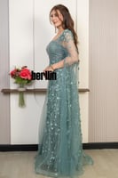 فستان سهرة ملكي بلون اخضر نعناعي بتطريز فاخر وورود...