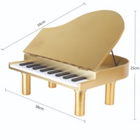 تحفة بيانو خشبي باللون الذهبي