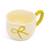 كوب سيراميك بتصميم فيونكة بارزة لون أصفر