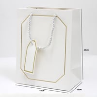 أكياس هدايا بإطار ذهبي