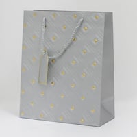 أكياس هدايا مزخرفة بنقاط ذهبية