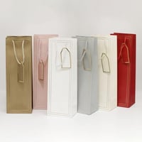 كيس هدايا طويل بإطار ذهبي