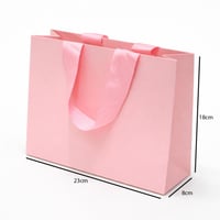 أكياس هدايا ورقية بمقبض شريطة عريض