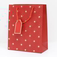 أكياس هدايا مزخرفة بنقاط ذهبية