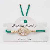 إسوارة اليوم الوطني بشعار السيفين والنخلة