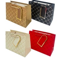 اكياس ورقية محفورة 23*10*18 بعدة الوان