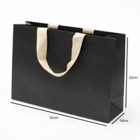 أكياس هدايا ورقية بمقبض شريطة عريض