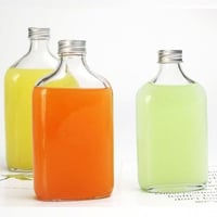 علب كولد برو زجاج 250 مل غطاء فضي + ذهبي