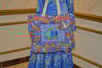 فستان ماريا انسيابية البحر وأناقة الشرق