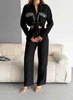 قميص مطرز بكريستالات وأحجار فخمة مصنوع من خامات عا...