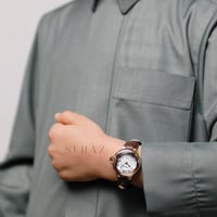 ساعة ولادي فاخره جلد بني مينا ابيض باطار دائري ذهب...