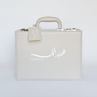 حقيبة جلدية فاخرة بلباس من TED BAKER