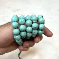 مسباح فاتوران فيروزي عقود