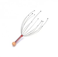 اداة معدنية لتدليك فروة الرأس