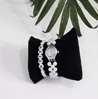 ساعة لؤلؤ واسورة اسم