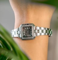 ساعة نسائية ستيل بلون فضي اسود