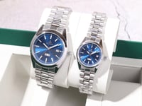 طقم ساعتين رجالية ونسائية بتصميم عصري وأنيق