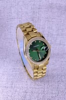 ساعة نسائية عملية شبيهة رولكس ذهبي والاخضر
