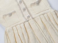 فستان قصير بتفاصيل فيونكة محبوكة من سيلف بورتريه