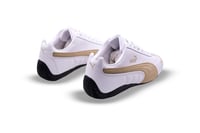 حذاء puma الابيض مع الذهبي