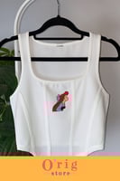 توب نسائي بشخصية اريل