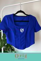 توب نسائي نص كم بشعار نادي الهلال