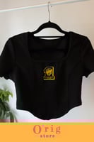 توب نسائي نص كم بشعار نادي الاتحاد